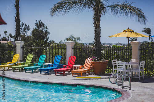 Pool with colorful lounge chairs