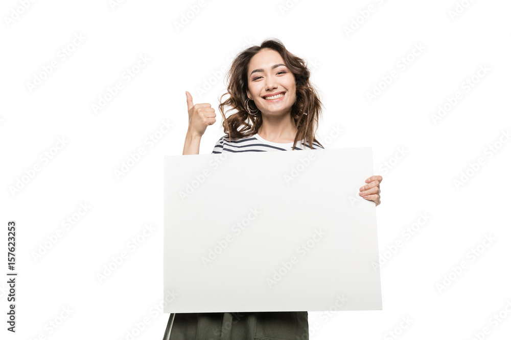 Smiling young woman holding blank white card and showing thumb up Smiling young woman holding blank white card and showing thumb up