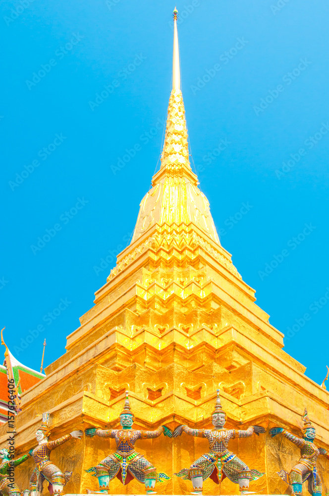 Giants under golden pagoda, Warrior statue at The Grand Palace and the temple Wat Phra Kaeo. Bangkok. Thailand. Giants under golden pagoda, Warrior statue at The Grand Palace and the temple Wat Phra Kaeo. Bangkok. Thailand.