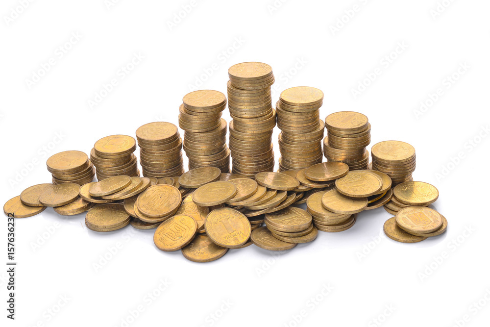 Coin stacks on a white background. Ukrainian hryvnia. Coin stacks on a white background. Ukrainian hryvnia.