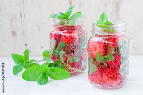 Summer refreshing water with strawberries and mint