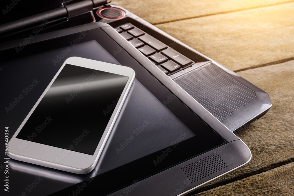 keyboard of Notebook with smartphone and tablet pc on desk keyboard of Notebook with smartphone and tablet pc on desk