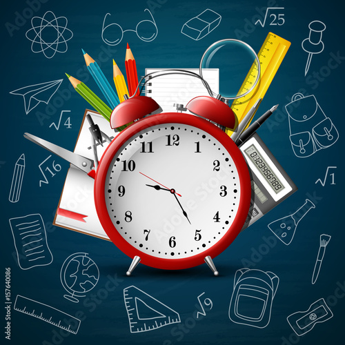 Back to school background with red alarm clock and school supplies
