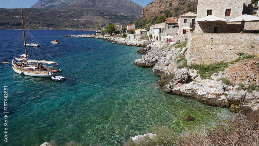 Photo of picturesque fishing village of Limeni with clear waters, Mani, Peloponnese, Greece
