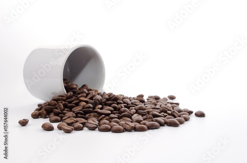 coffee beans and white coffee cup on white background