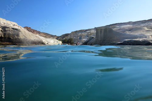 Photo of volcanic island of Milos with clear waters and caves  Cyclades  Greece