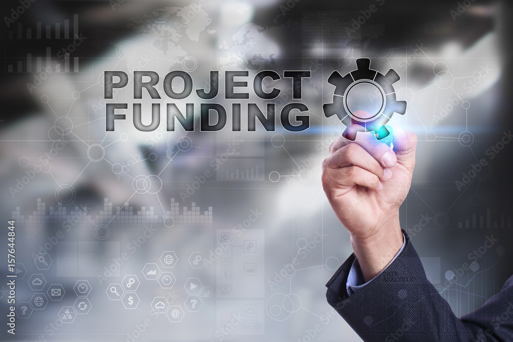 Businessman is drawing on virtual screen. project funding concept. Businessman is drawing on virtual screen. project funding concept.