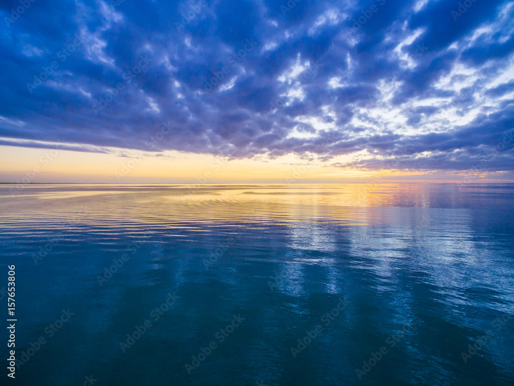 Beautiful quiet dusk in the ocean - nothing but water and sky