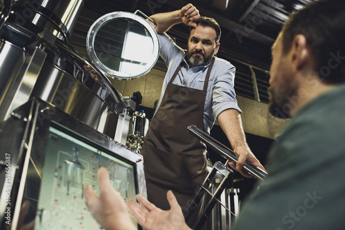 Brewers working with tanks