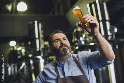 Photography Brewery worker with glass of beer