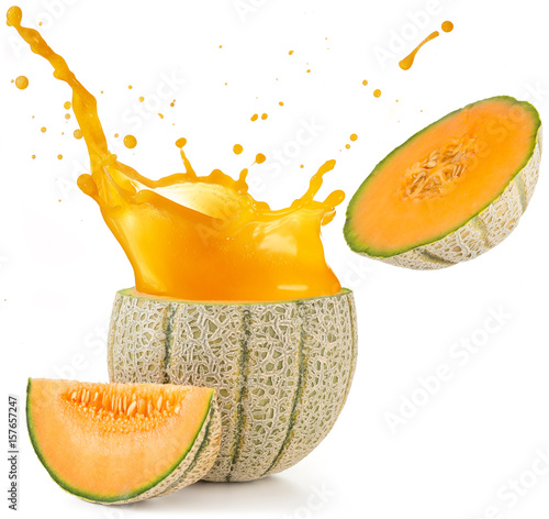 orange juice splashing out of a melon isolated on white