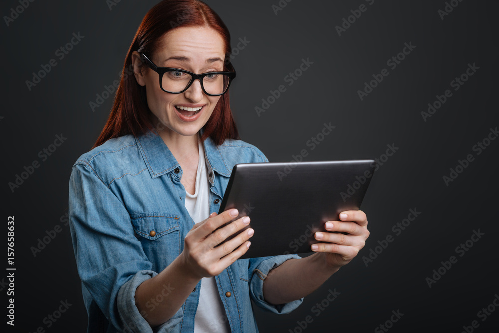 Bright emotional woman surprised with what she finding Bright emotional woman surprised with what she finding