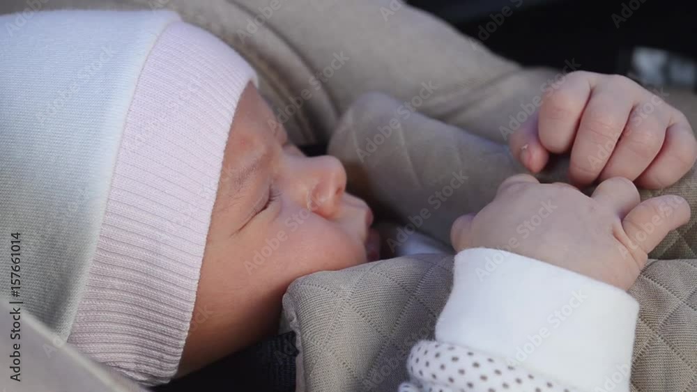 baby closeup sleep in car seat in car, safe transportation of children