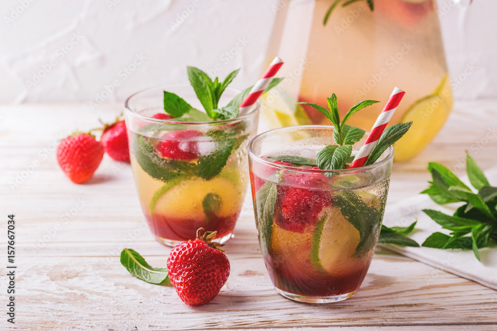 Cold lemonade with fresh strawberry, mint, lime and jam