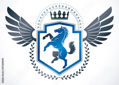 Vintage winged emblem created in vector heraldic design and composed using horse illustration and imperial crown.