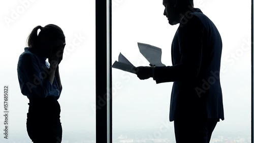  Young businesswoman getting rebuke from boss in the office
