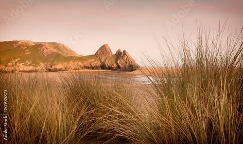 Dramatic Three Cliffs Bay on the Gower peninsula, Swansea, South Wales, UK photo