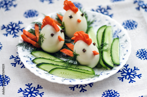 Funny chickens from eggs, baby food on the Christmas table with the symbol of 2017 © Natalia Sidorova