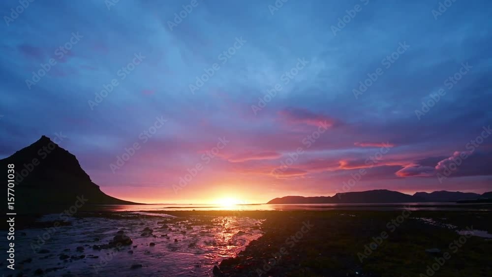 Icelandic landscape on Lake Myvatn, with yellow flowers in the foreground Icelandic landscape on Lake Myvatn, with yellow flowers in the foreground