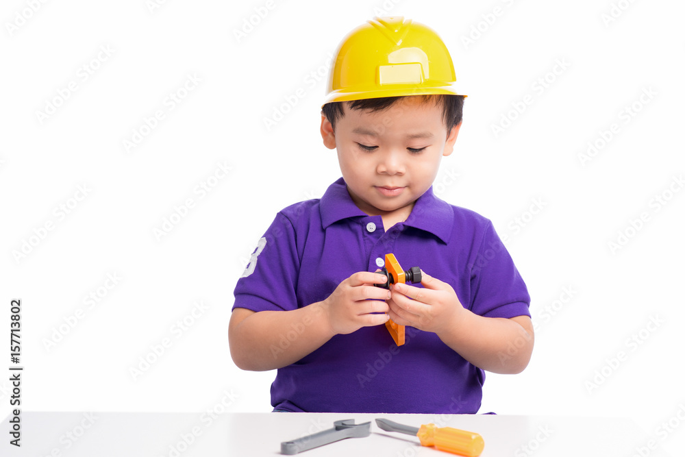 Little repairman in hardhat with repair tools Little repairman in hardhat with repair tools