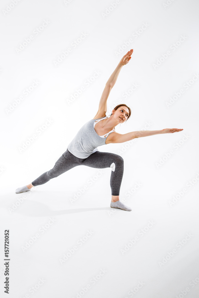 Young brunette exercising in yoga