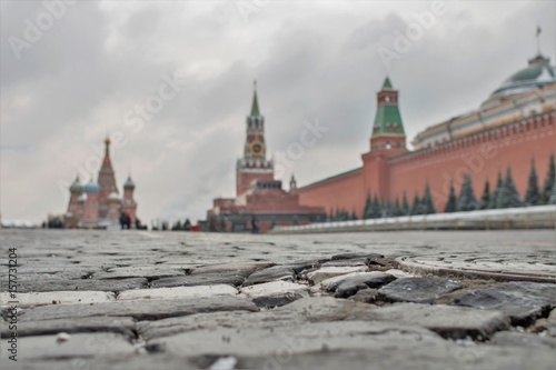 Moscow, Russia - May 7, 2017: Uneven stones on Red square in the background of grey sky. Kremlin is a fortress, the main socio-political, historical and artistic complex of the city