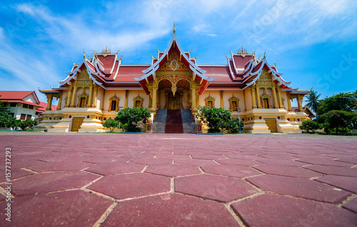 Beautiful temple of Pha That with blue sky at Vientiane , Famous public landmark in Lao.