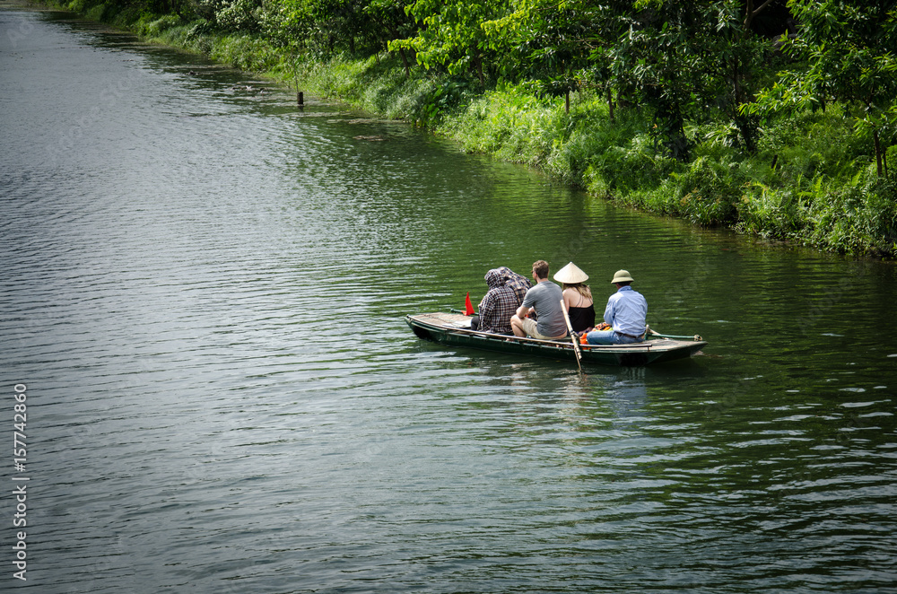 Boat with tourist travel around trang an Vietnam world heritage with moutain, rivel and sky. Boat with tourist travel around trang an Vietnam world heritage with moutain, rivel and sky.