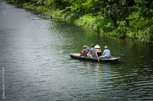 Boat with tourist travel around trang an Vietnam world heritage with moutain, rivel and sky.