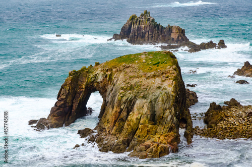 Enys Dodman, a rock arch about 1km south of Lands End, Cornwall, UK. Seen from Pordenack Point.