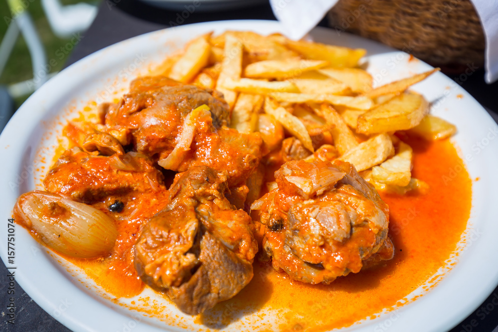 Stifado with fries on the plate. Greek dish Stifado with fries on the plate. Greek dish
