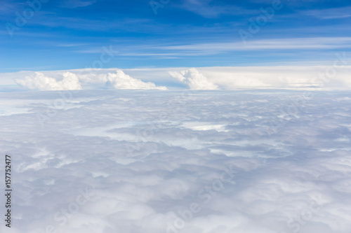Beautiful fluffy white cumulus clouds on blue sky background.