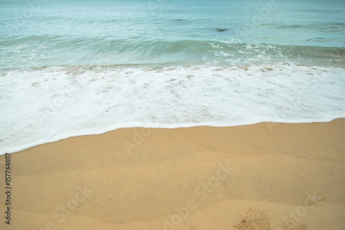 White bubble of sea water on the sand beach