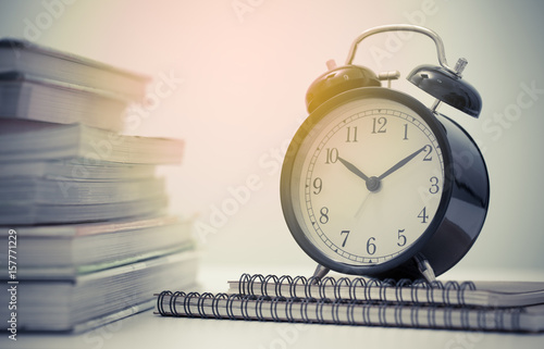 Vintage clock and stack of books