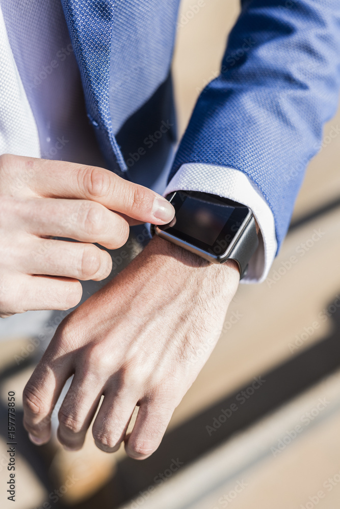 Close-up of businessman with smartwatch Close-up of businessman with smartwatch