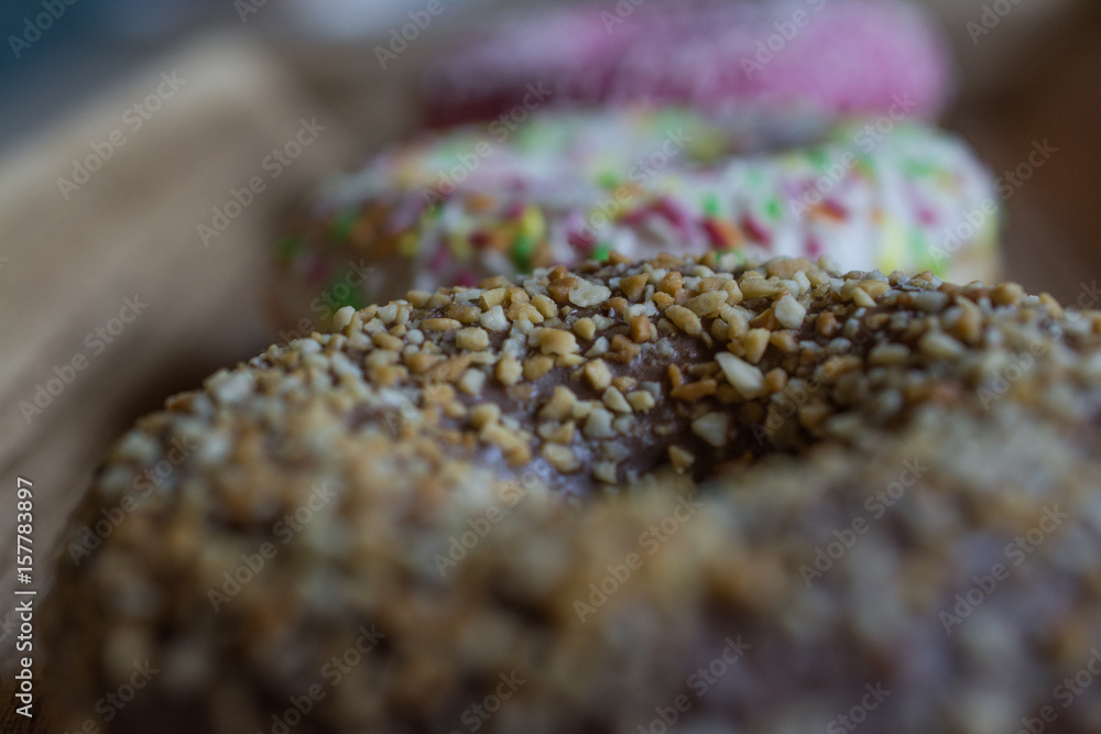 Sweet donut with chocolate and nuts with others donuts Sweet donut with chocolate and nuts with others donuts