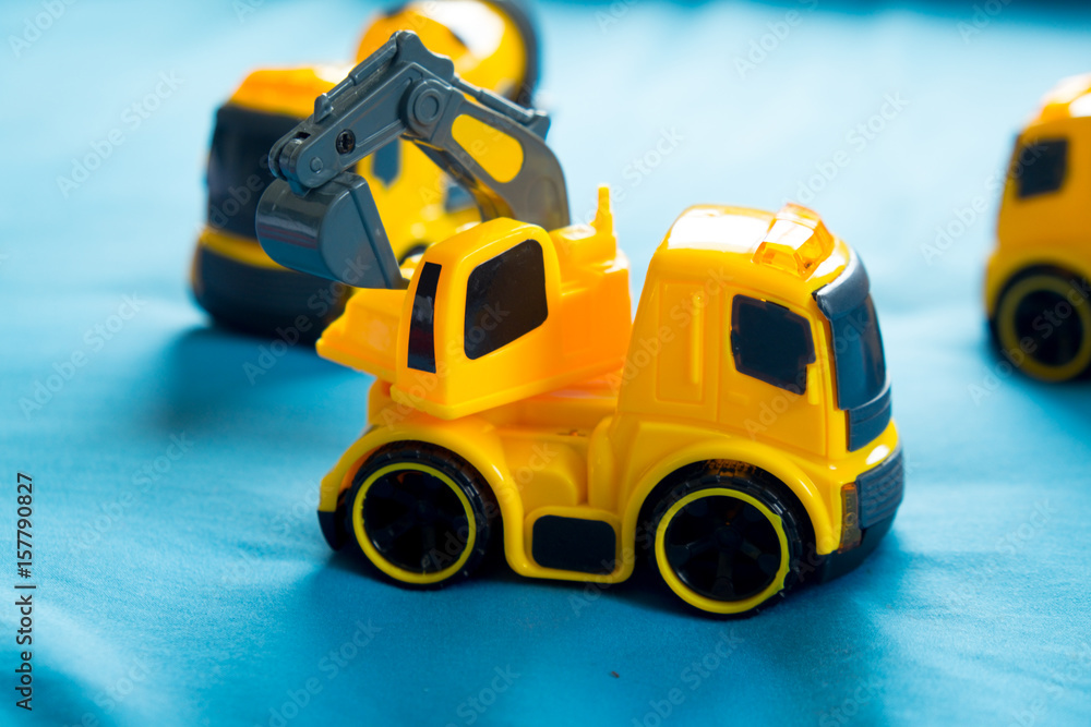 Fototapeta premium Children's toy yellow tractor