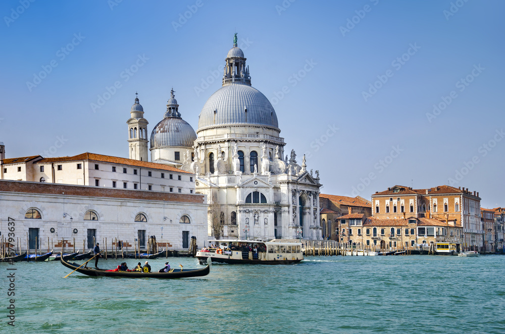Venice Canal. Beautiful Gondola in front of basilica Santa Maria della Salute