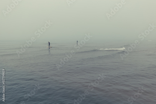 Surfers in the fog near Lokken