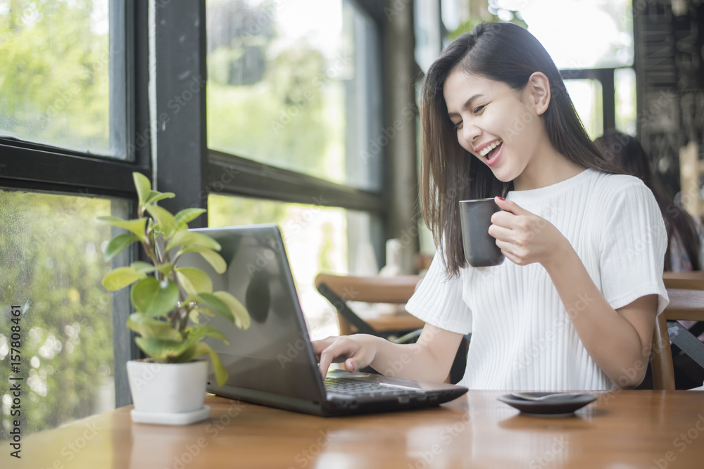 Beautiful business girl working with tablet , smartphone and drinking coffee in coffee shop Beautiful business girl working with tablet , smartphone and drinking coffee in coffee shop