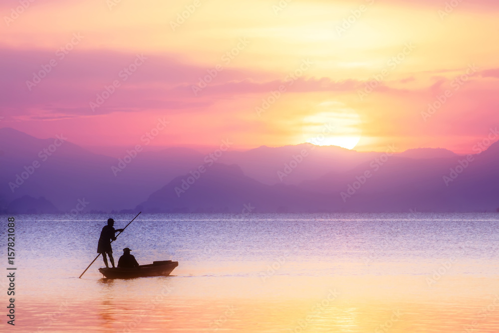 Beautiful sky and Silhouettes of Minimal fisherman at the lake in pastel color.