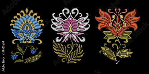 Fototapeta Naklejka Na Ścianę i Meble -  Embroidery design. Collection of floral elements for fabric and textile prints, patches or stickers. Beautiful ethnic flowers ornament in traditional Ukrainian decorative painting style of Petrykivka.