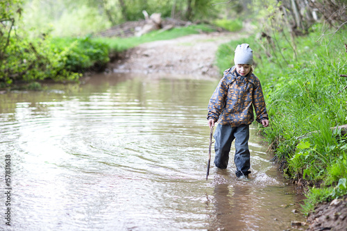 Boy walking in the forest