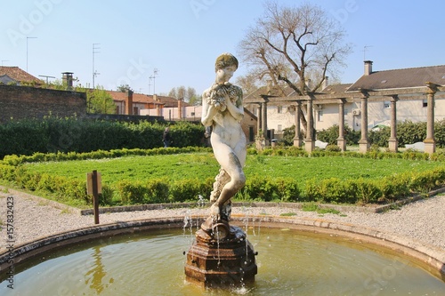 Obraz na plátne In the town Adria, Italy: The public park Giardini Scarpari, statue of a woman with vines in the center