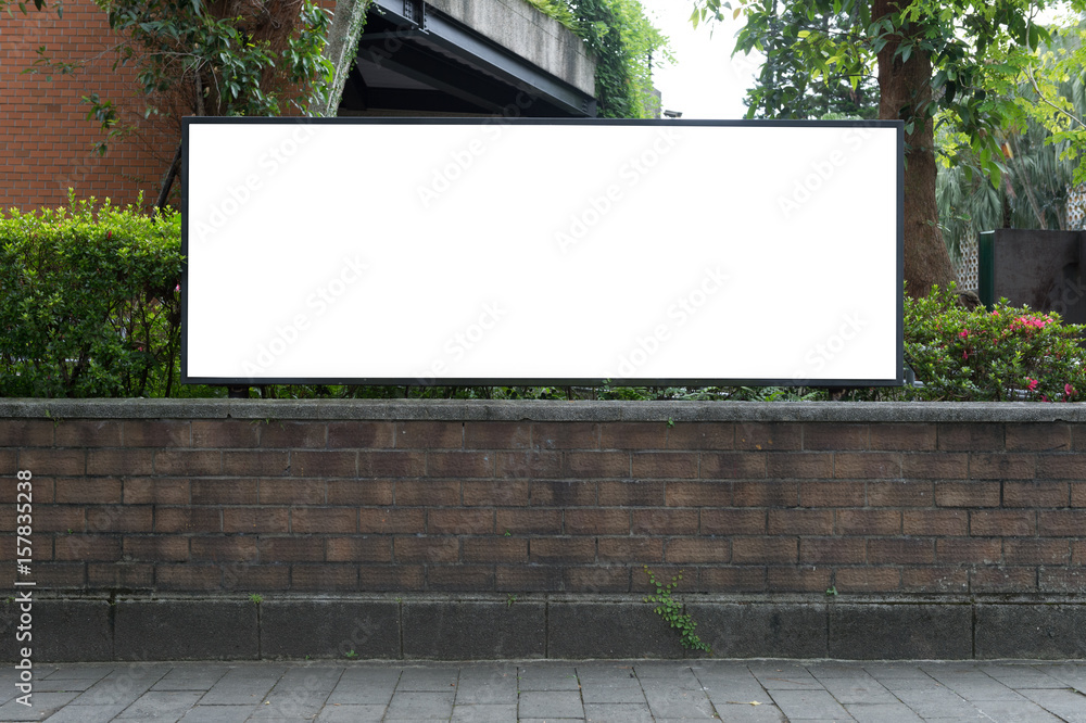 Fototapeta premium Large blank billboard on a street wall, banners with room to add your own text