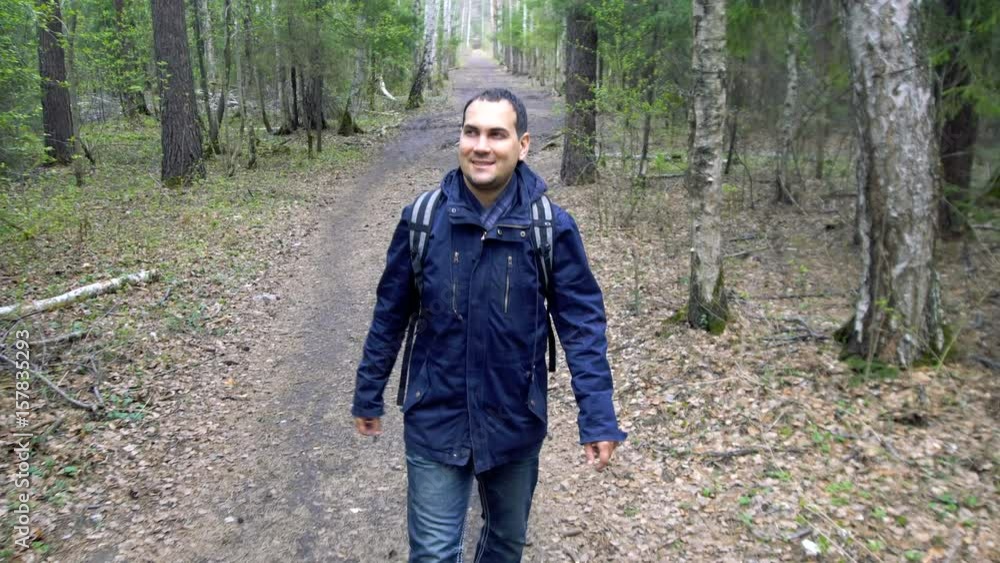 Man Walking in Spring Forest Man Walking in Spring Forest