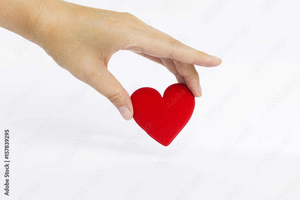 Hand holding red heart on white background, Valentine concept Hand holding red heart on white background, Valentine concept