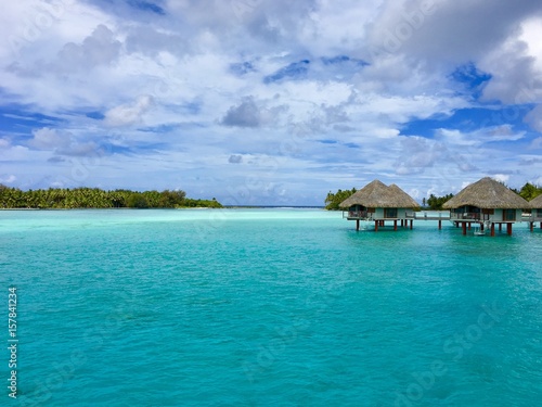 Beautiful turquoise lagoon of Bora Bora and the overwater bungalows of a luxury resort © Thorsten