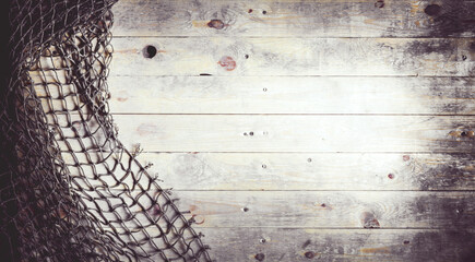 Fishing nets on wooden background. Still-life and objects.