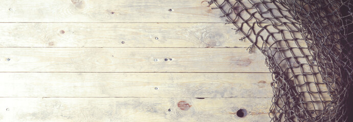 Fishing nets on wooden background. Still-life and objects.